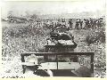 1943. 10. 01. NEW GUINEA. ATTACK ON KAIAPIT. AUSTRALIAN INFANTRY RIDE IN JEEPS TO THE AIRSTRIP FROM WHICH TRANSPORT PLANES WILL CARRY THEM TO THE FRONT