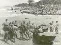 Aitape, New Guinea. 8 February 1945. Cloudburst in mountains swell rivers. Note jeep drawn up to newly formed bank. On opposite side can be seen a truck.