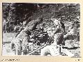 BARGES HILL, CENTRAL BOUGAINVILLE, 1945-06-26. GNR K. URWIN (1) AND L-BDR N. HEALEY (2), MEMBERS OF 2 MOUNTAIN BATTERY DISMANTLING JEEPS