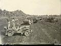 BUT, NORTHERN NEW GUINEA. 1945-04-02. FLYING OFFICER J. C. RUSH OF EARLWOOD, NSW, WITH AN AUSTRALIAN ARMY COLONEL STANDING IN A JEEP, SERIAL NO. 58091