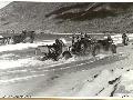 CAIRNS, QLD. 1943-06-25. JEEP HAULING 2-POUNDER TANK ATTACK GUN FROM LANDING BARGE DURING COMBINED INVASION EXERCISE.