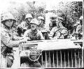 Soldiers from the 192nd Tank Bn. with Japanese prisoners in a Bantam 40 BRC, Apr. 9 1942