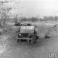 Four wheel steering jeep uder testing. Ford GP, Willys MBs. Baltimore, Maryland, USA, February 1942.