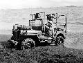 A U.S. Marine driving an ambulance jeep struggles in the sandy beach at Iwo Jima.Feb. 26, 1945.