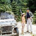 JOHN WAYNE DONOVAN'S REEF 8X10 PHOTO RARE ON SET BY JEEP HOLDING MACHETE