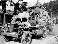 Glenn Ford (Gwyllyn Ford) driving a jeep carrying American actor Marlon Brando,