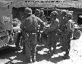 USMC 89611 A wounded Marine is brought into a forward aid station by a jeep ambulance, Korea, 3 September 1950.