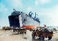 20342806-S MB Jeeps of the 261st Amphibious Medical Battalion's A-Company race across Utah Beach 12th June 1944