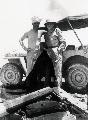 20101640 GPW  Two crewmen of a B-24 Liberator by a covered Jeep