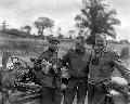 20362152-S MB 2nd AD Robert Capa (the famous war photographer), their driver - Pfc. Olin L. Tompkins and Ernest Hemingway,Pont Brocard, Normandy. 30 July 1944.