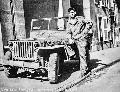 Paul or Paulette  Paul C. Martz with his Jeep parked along a street in Verdun, France on September 28, 1944. It was decorated with Paul or Paulette below the windshield.