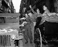 2083032-S MB An Army jeep driver gives fellow GI's the good news that the Japs have given up - Paris